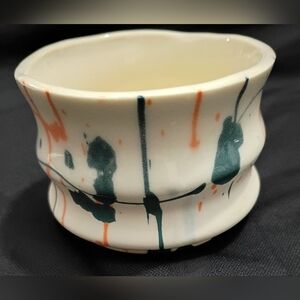 Handcrafted White Ceramic Planter with Teal and Orange Drip Design